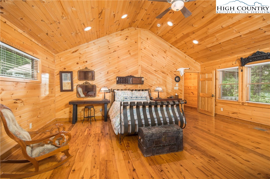 175 Woods Road Boone, NC 28607 - Photo 19 of 50 a view of a patio with a table and chairs with wooden floor and fence
