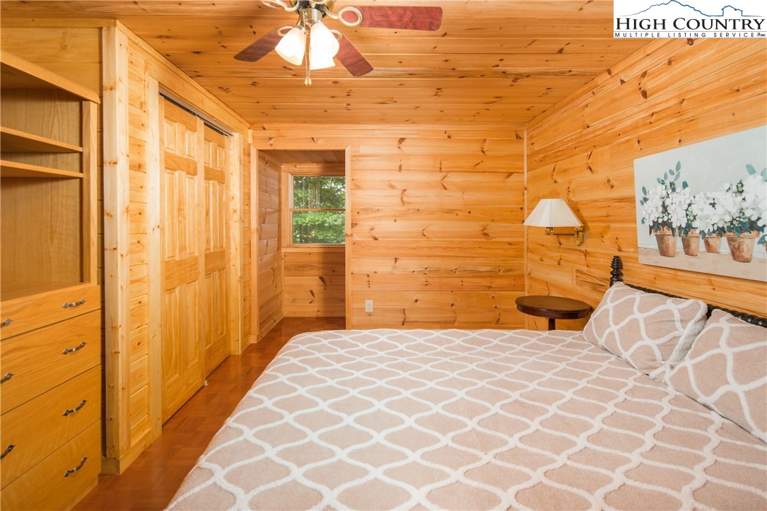175 Woods Road Boone, NC 28607 - Photo 31 of 50 a bedroom with a bed and a painting on the wall