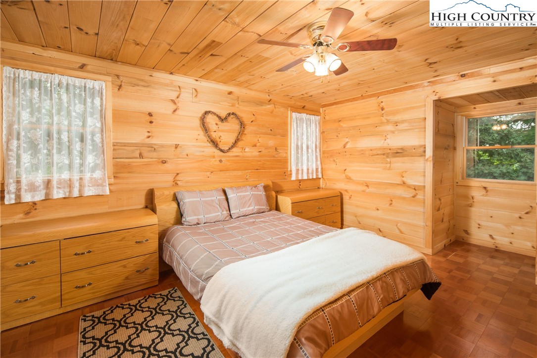 175 Woods Road Boone, NC 28607 - Photo 34 of 50 a bedroom with a bed and a window
