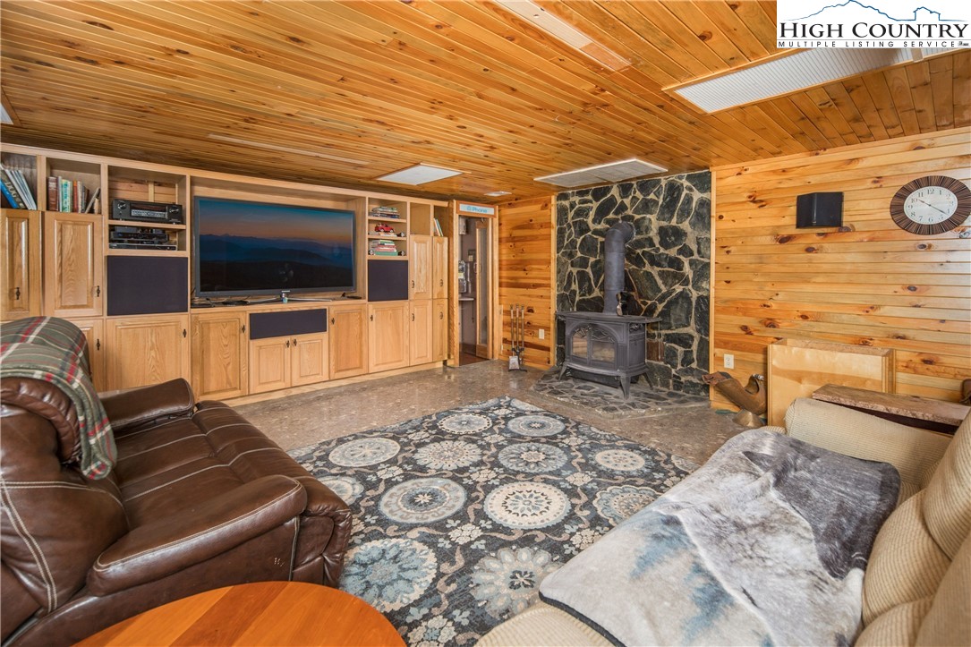 175 Woods Road Boone, NC 28607 - Photo 42 of 50 a living room with furniture and a flat screen tv
