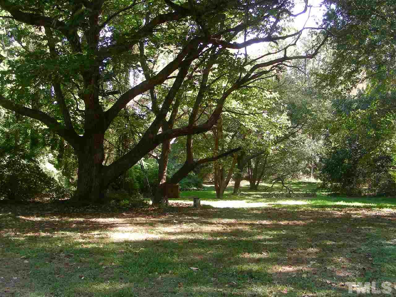 3313 Garner Road Raleigh, NC 27610 - Photo 2 of 10 a backyard of a house with lots of green space
