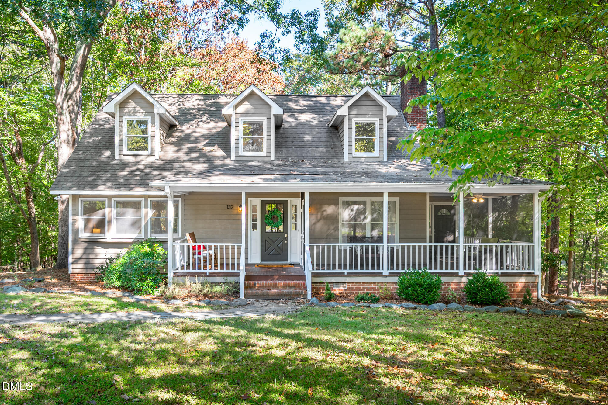 132 Hudson Hills Road Pittsboro, NC 27312 - Photo 1 of 43 a front view of a house with a yard