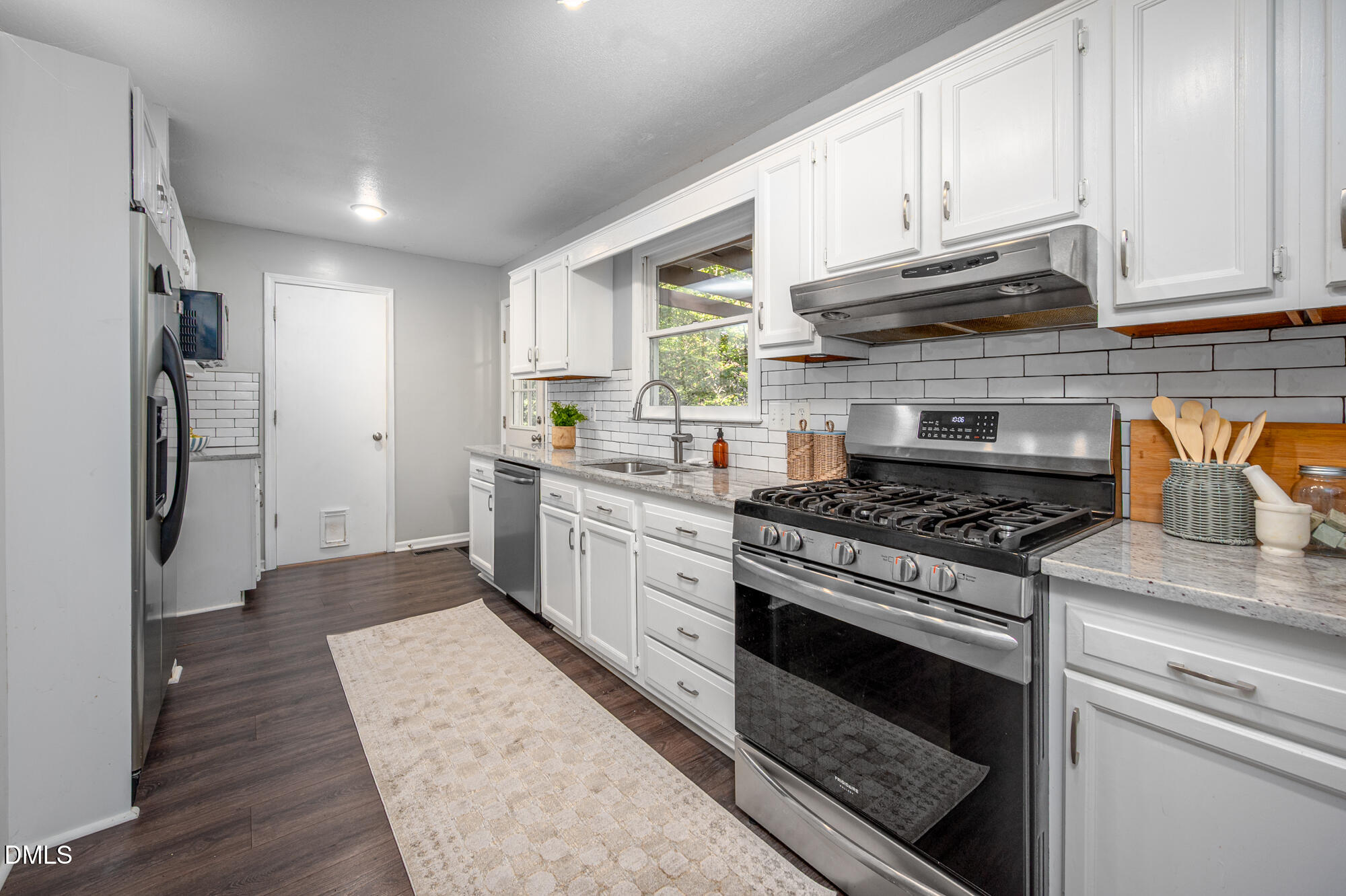 132 Hudson Hills Road Pittsboro, NC 27312 - Photo 10 of 43 a kitchen with a stove and a refrigerator