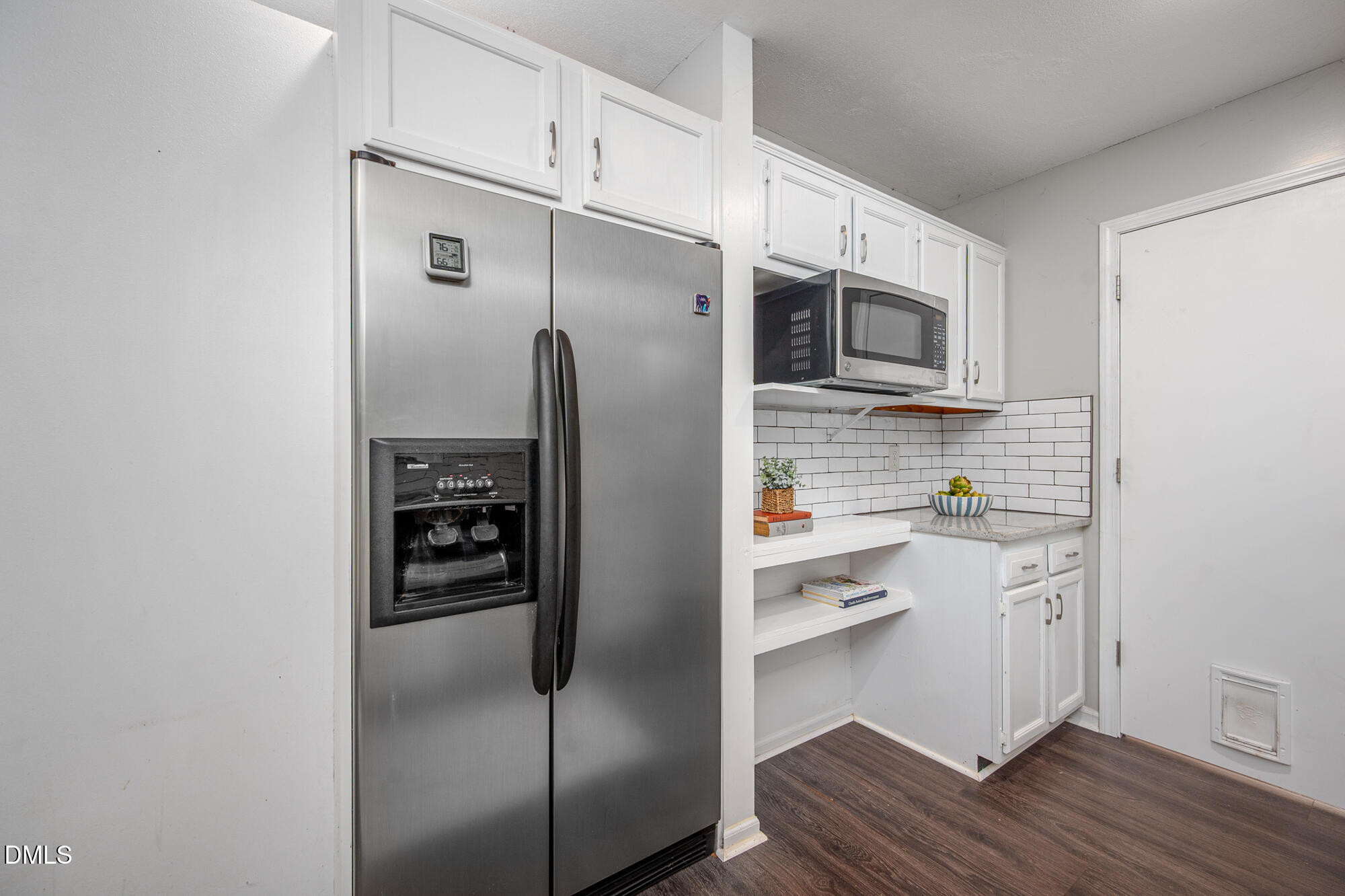 132 Hudson Hills Road Pittsboro, NC 27312 - Photo 12 of 43 a kitchen with stainless steel appliances a refrigerator and cabinets