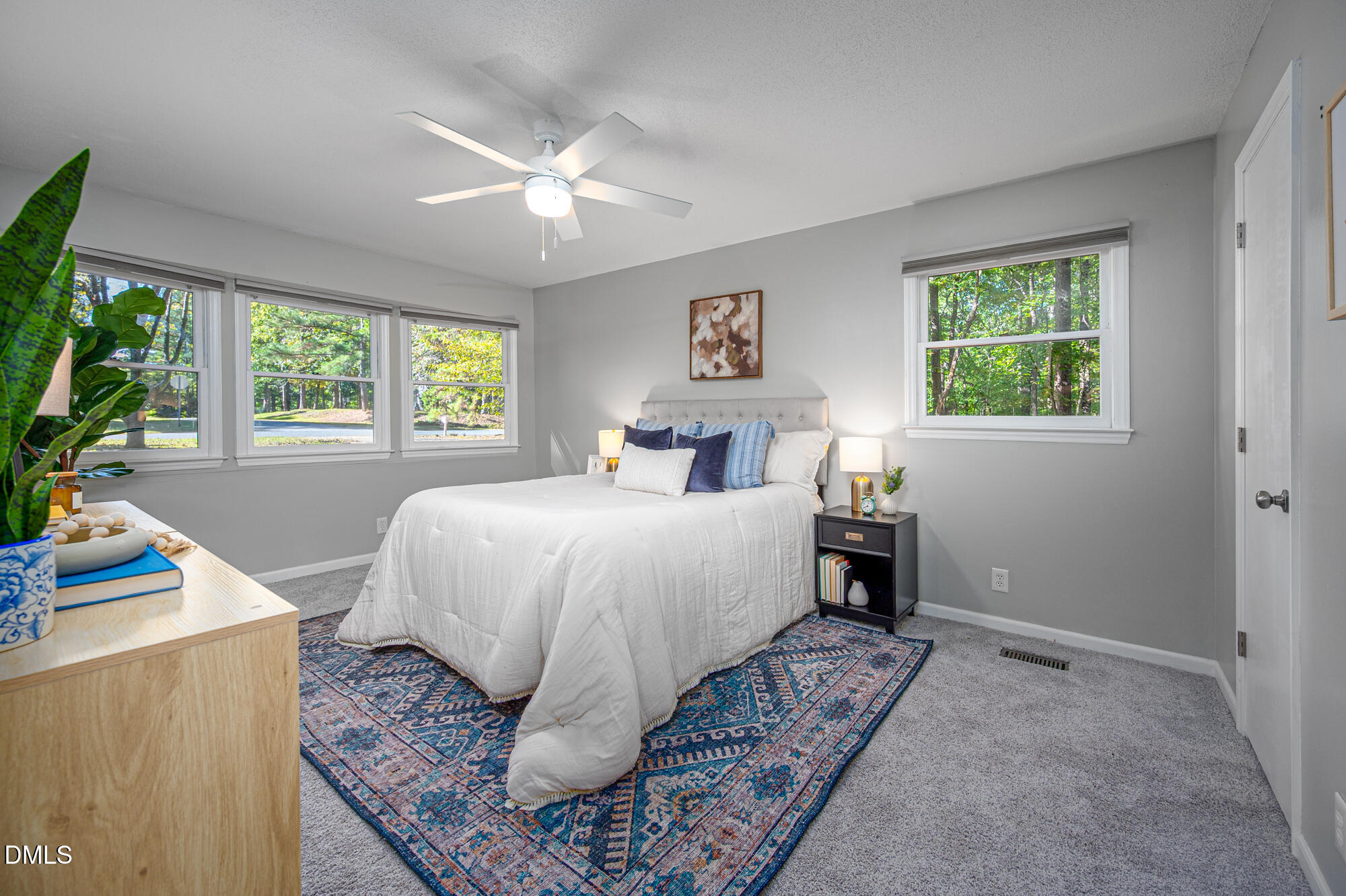 132 Hudson Hills Road Pittsboro, NC 27312 - Photo 13 of 43 a bedroom with a bed and a large window
