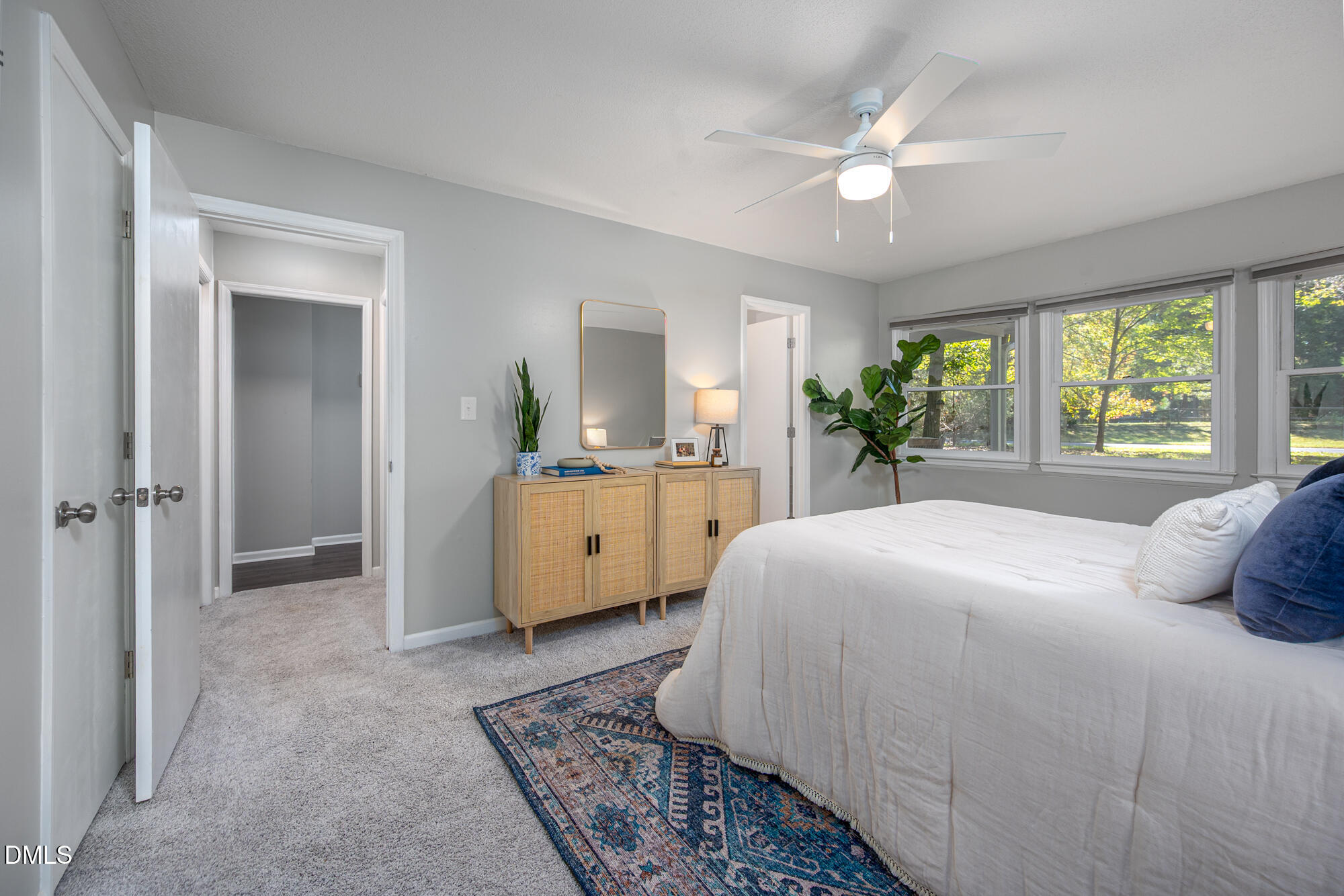 132 Hudson Hills Road Pittsboro, NC 27312 - Photo 14 of 43 a bedroom with a bed a large window and mirror