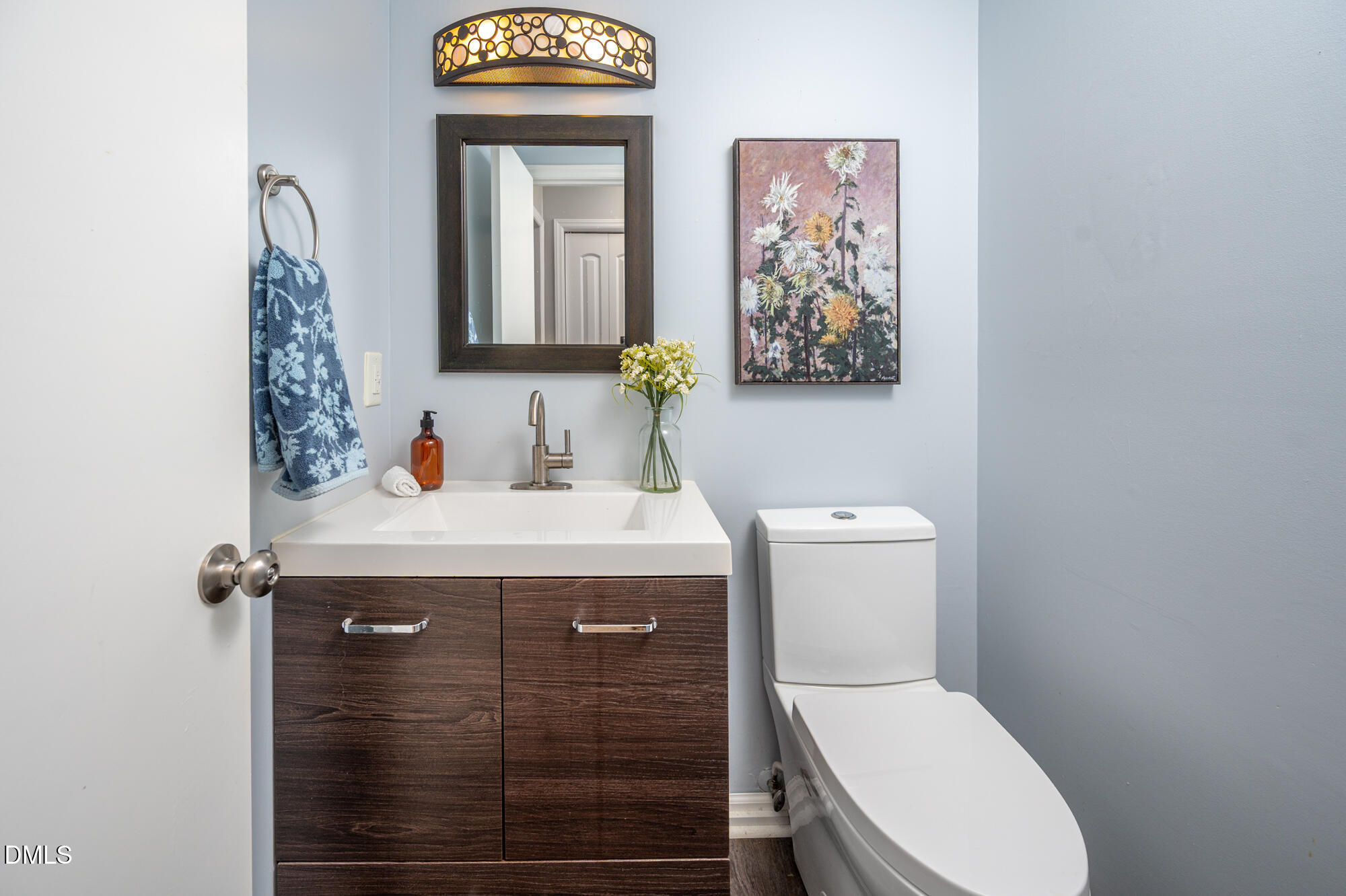 132 Hudson Hills Road Pittsboro, NC 27312 - Photo 20 of 43 a bathroom with a toilet sink vanity and mirror