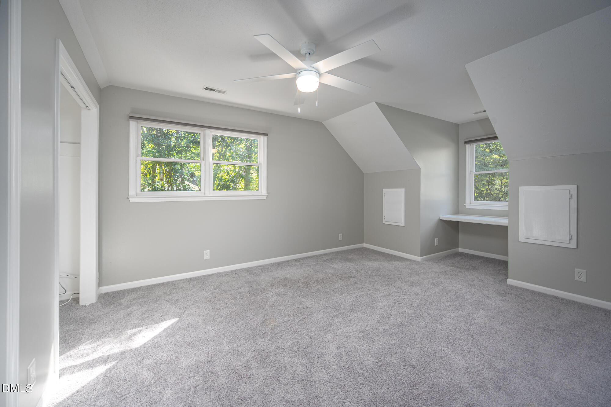 132 Hudson Hills Road Pittsboro, NC 27312 - Photo 23 of 43 an empty room with windows and ceiling fan