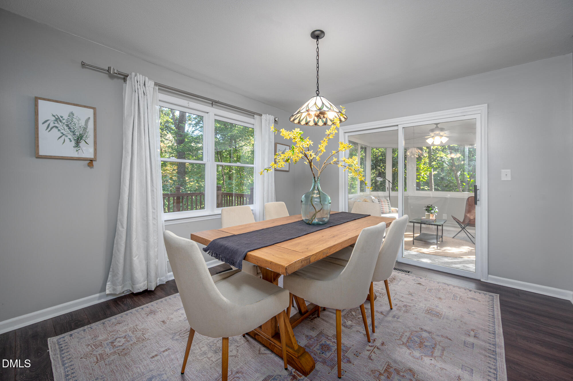 132 Hudson Hills Road Pittsboro, NC 27312 - Photo 6 of 43 a dining room with furniture a chandelier and wooden floor
