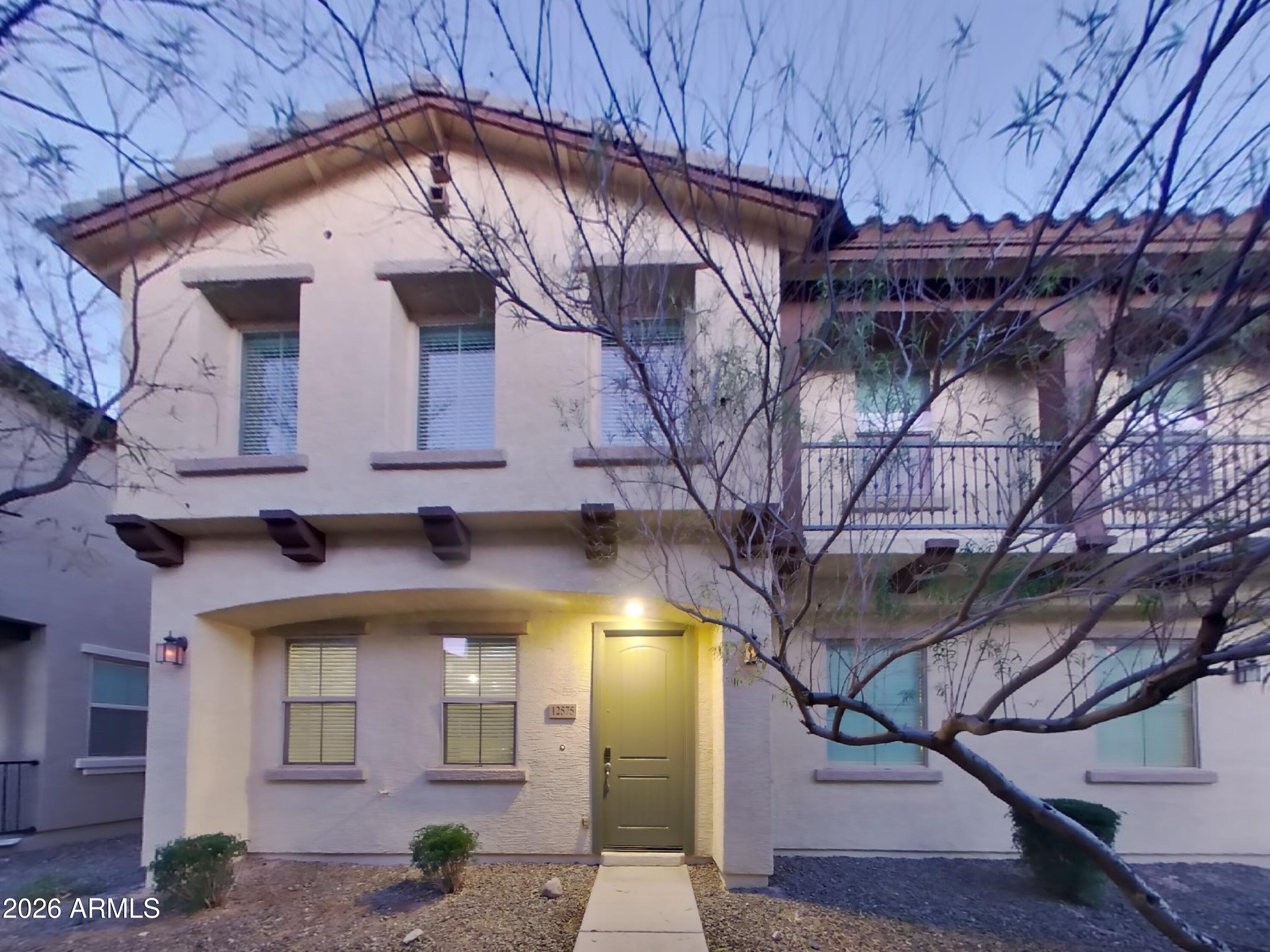 a view of a building with a tree