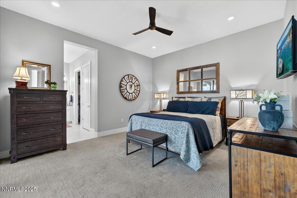 2160 Woodhouse Drive Reno, NV 89521 - Photo 14 of 38 a spacious bedroom with a bed a dresser and painting on the wall