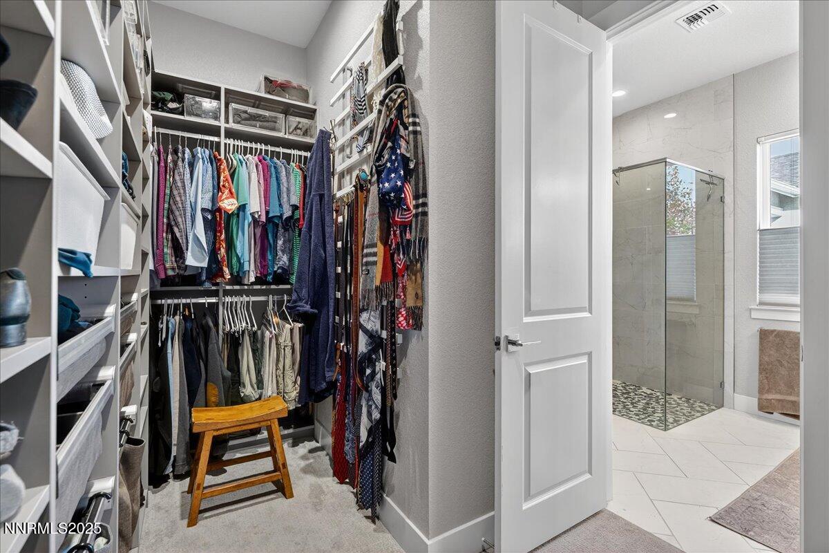2160 Woodhouse Drive Reno, NV 89521 - Photo 18 of 38 a view of walk in closet with clothes and shoes