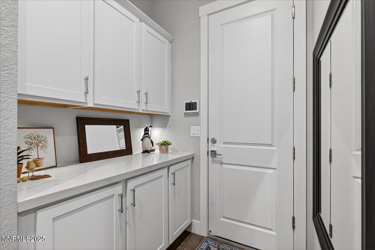 2160 Woodhouse Drive Reno, NV 89521 - Photo 21 of 38 a kitchen with white cabinets and white appliances