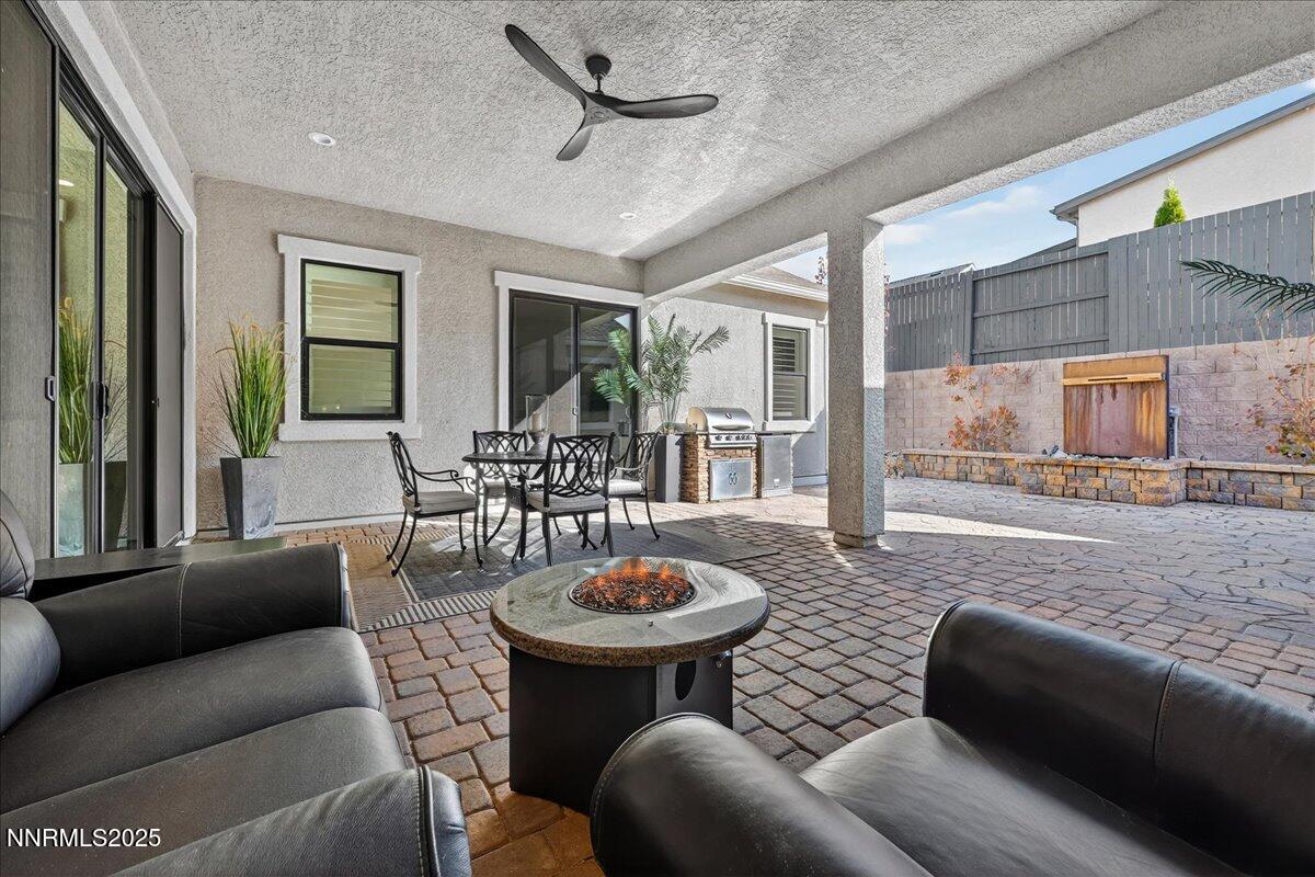2160 Woodhouse Drive Reno, NV 89521 - Photo 25 of 38 a living room with furniture a rug and a large window