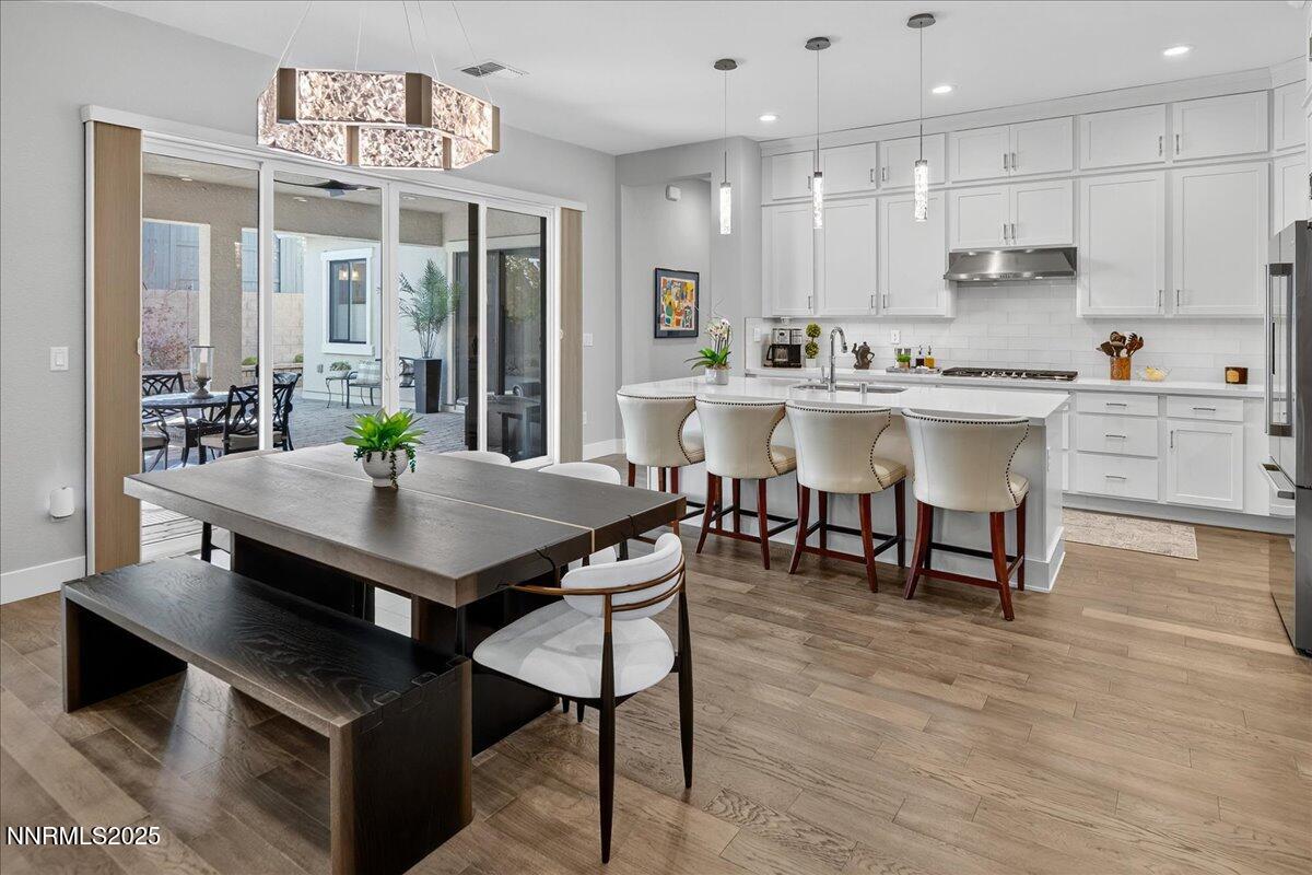 2160 Woodhouse Drive Reno, NV 89521 - Photo 5 of 38 a view of kitchen with cabinets table and chairs