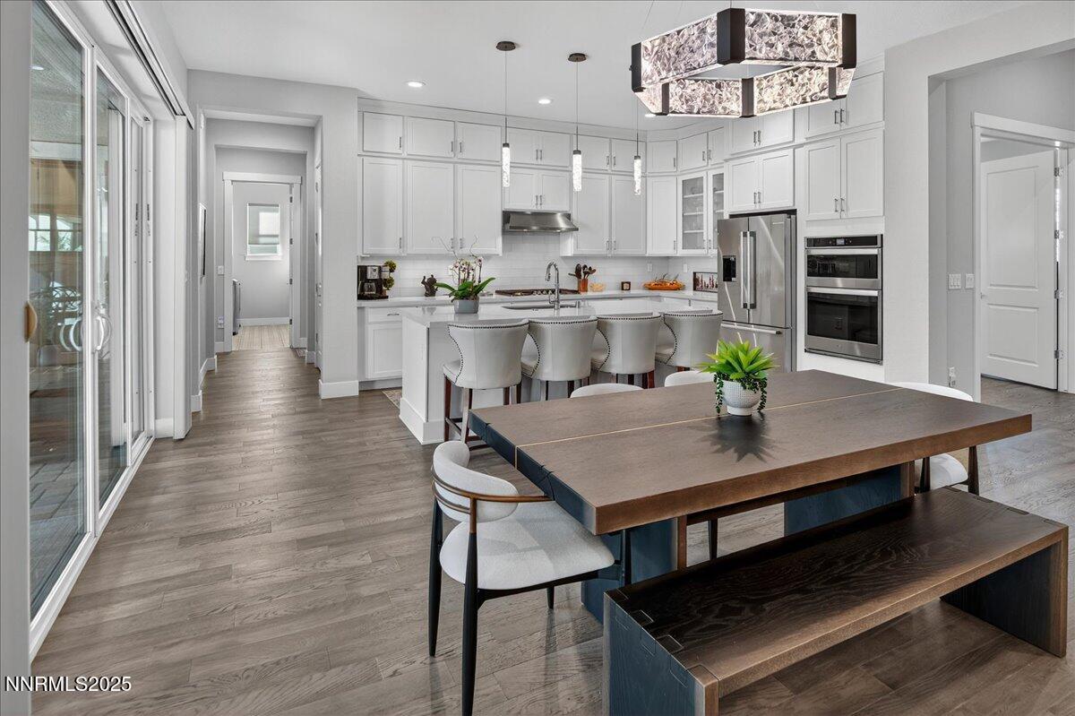2160 Woodhouse Drive Reno, NV 89521 - Photo 6 of 38 a view of kitchen with cabinets table and chairs