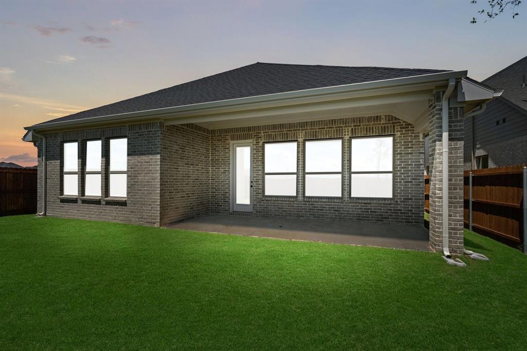 1792 Monarch Way Oak Point, TX 75068 - Photo 22 of 26 a backyard of a house with a garden and barbeque oven
