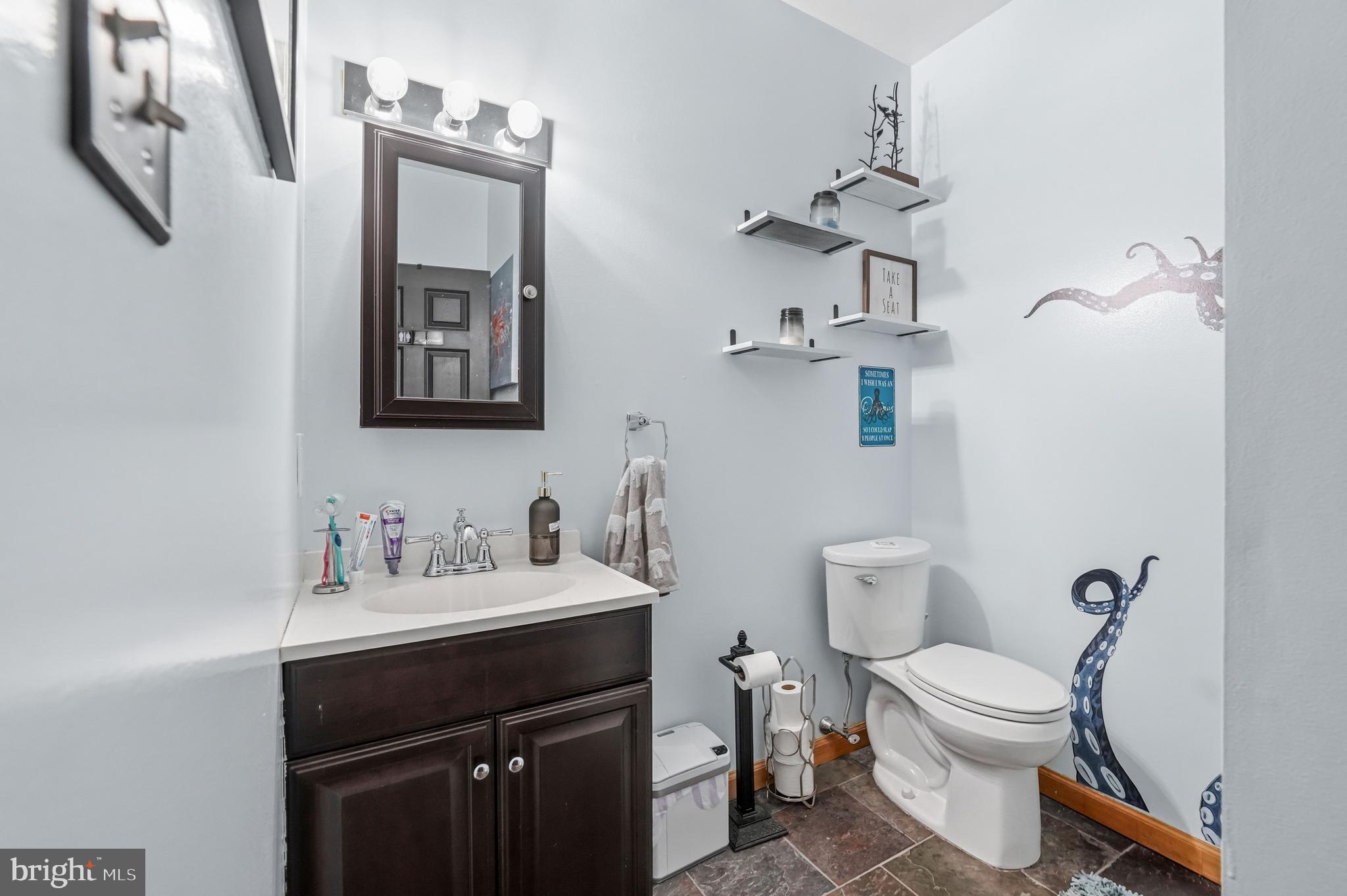 705 Garden Road Pittsgrove, NJ 08318 - Photo 51 of 72 a bathroom with a toilet sink and mirror