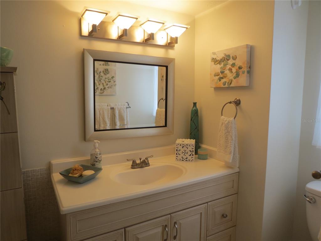 615 South Palm Avenue, Unit 4 Sarasota, FL 34236 - Photo 12 of 16 a bathroom with a sink and a mirror