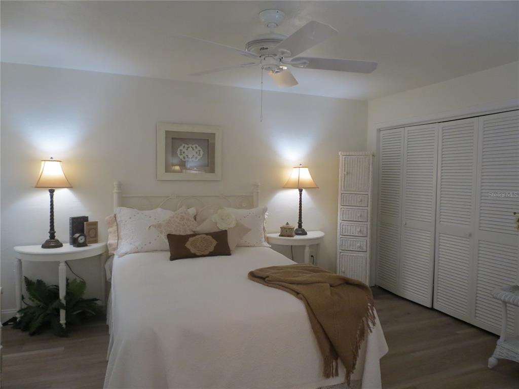 615 South Palm Avenue, Unit 4 Sarasota, FL 34236 - Photo 14 of 16 a bedroom with a bed and a table lamp