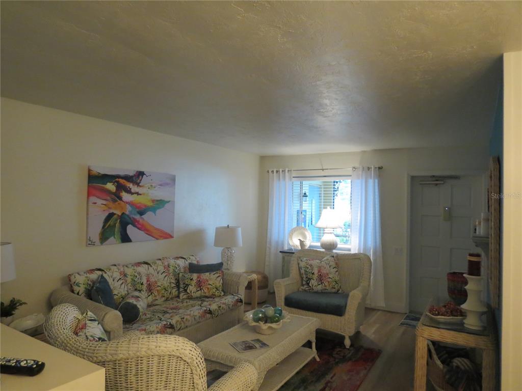 615 South Palm Avenue, Unit 4 Sarasota, FL 34236 - Photo 7 of 16 a living room with furniture and a window