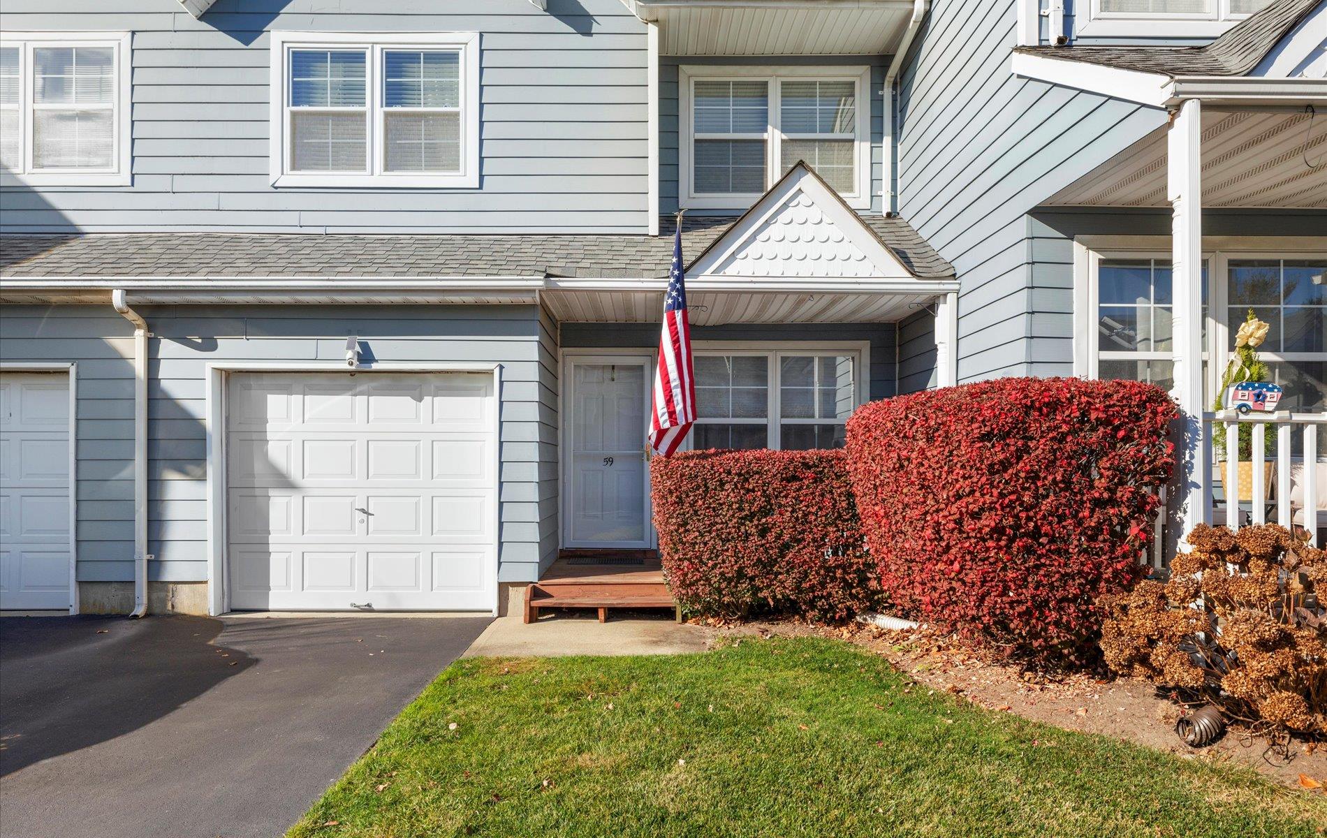 59 Pleasantview Drive Central Islip, NY 11722 - Photo 1 of 1 a front view of a house with garden
