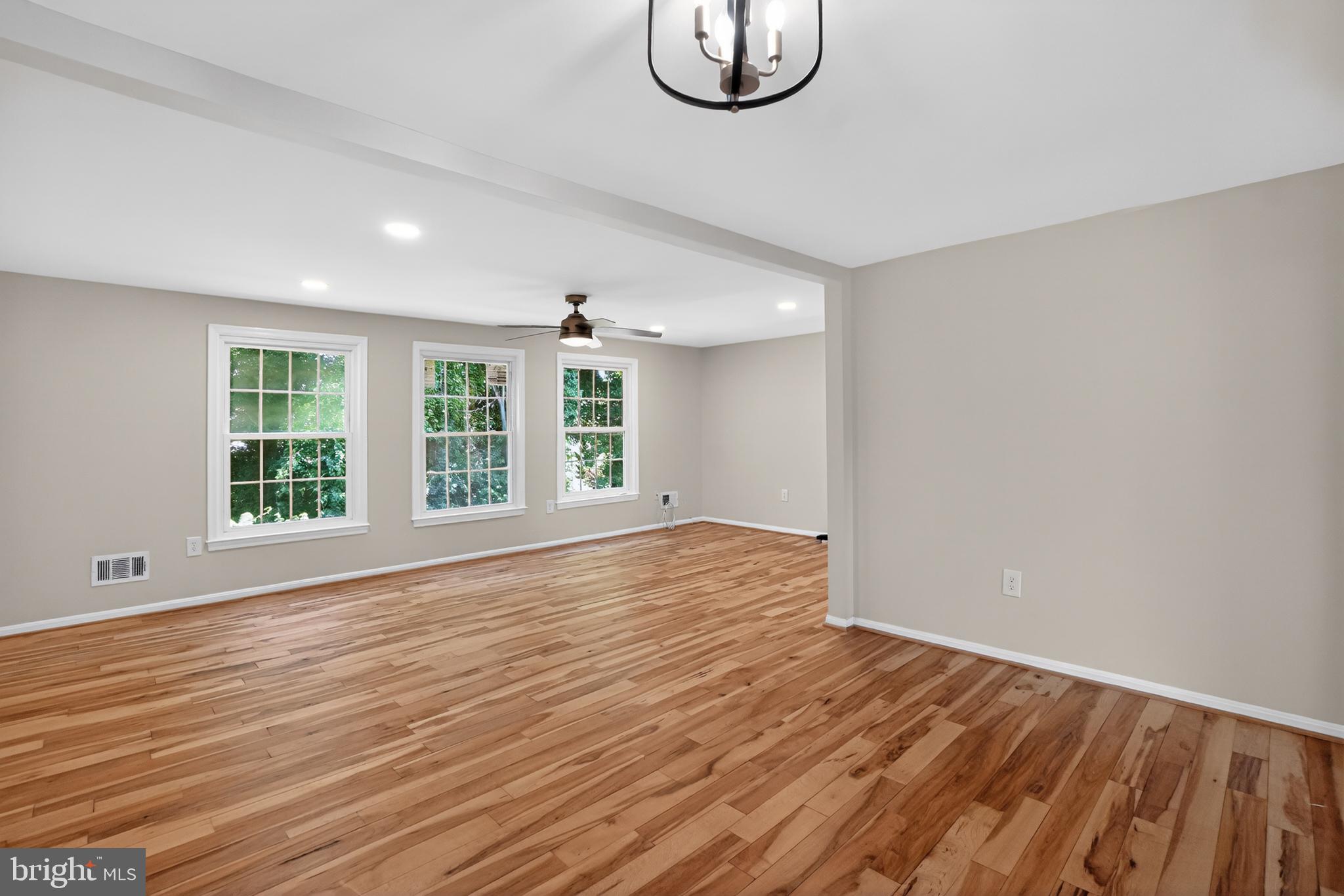 1232 Palmer Road, Unit 111 Fort Washington, MD 20744 - Photo 16 of 45 a view of empty room with wooden floor and fan