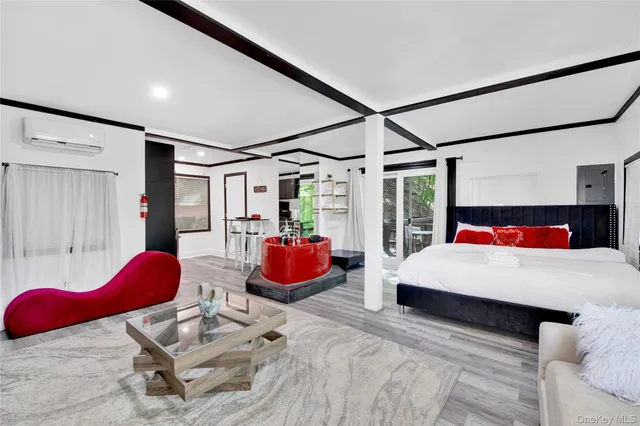 a bedroom with a bed and a window