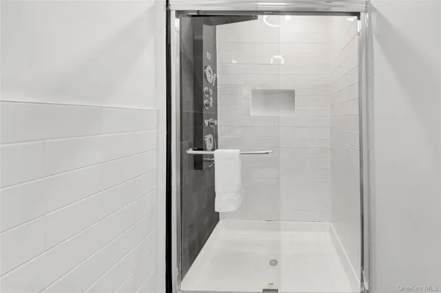 a bathroom with a glass shower door