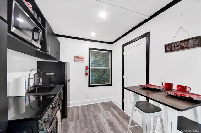a kitchen with stainless steel appliances granite countertop a stove and a refrigerator