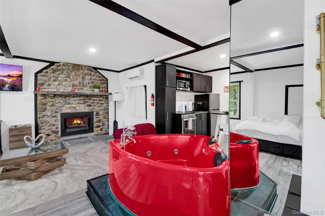 a living room with furniture fireplace and flat screen tv