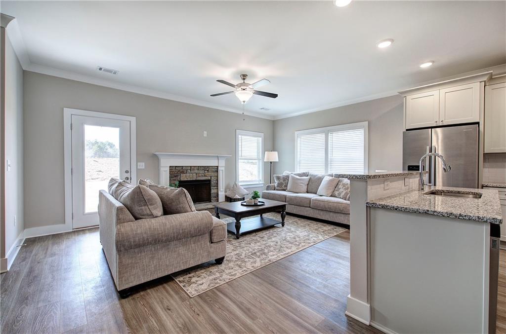 200 Daisy Court Cartersville, GA 30121 - Photo 25 of 73 a living room with furniture and a fireplace