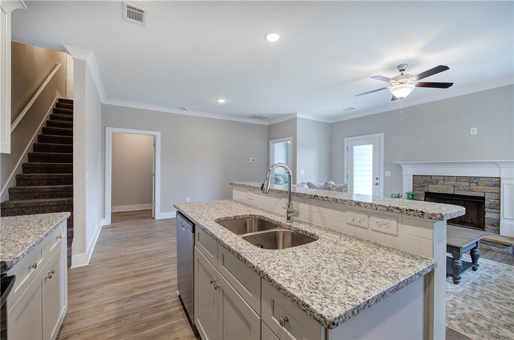 200 Daisy Court Cartersville, GA 30121 - Photo 31 of 73 a kitchen with sink cabinets and chandelier