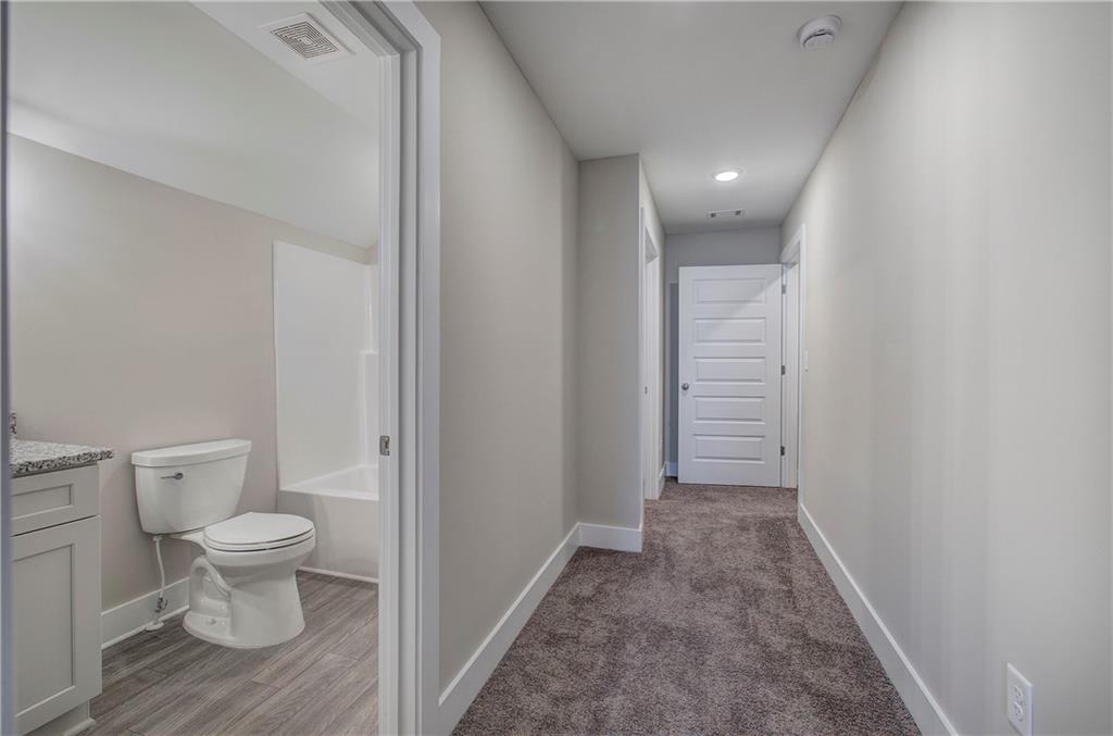 200 Daisy Court Cartersville, GA 30121 - Photo 51 of 73 a view of a hallway with toilet and a sink