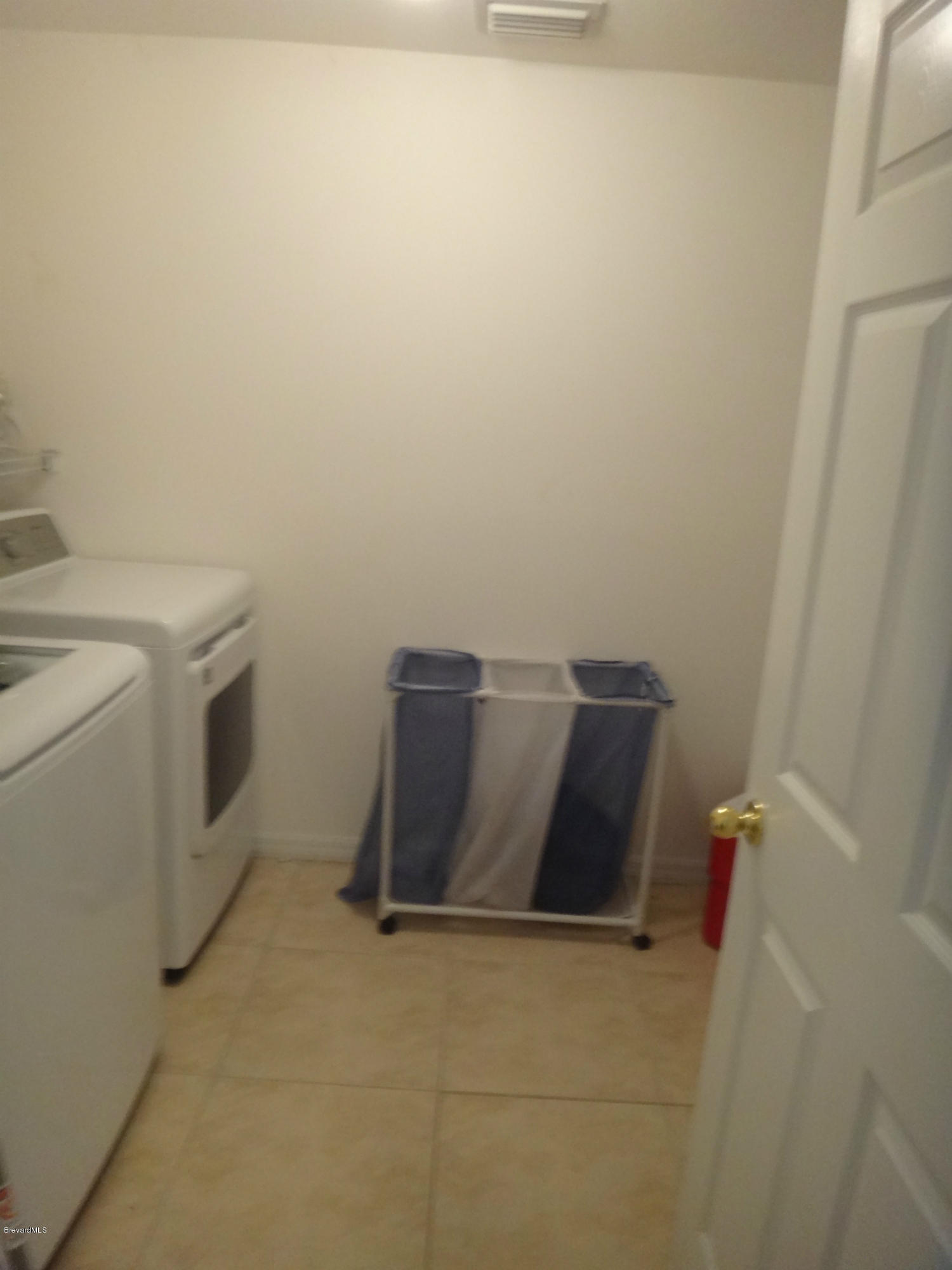 783 Fletcher Road Southeast Palm Bay, FL 32909 - Photo 15 of 17 Laundry Room