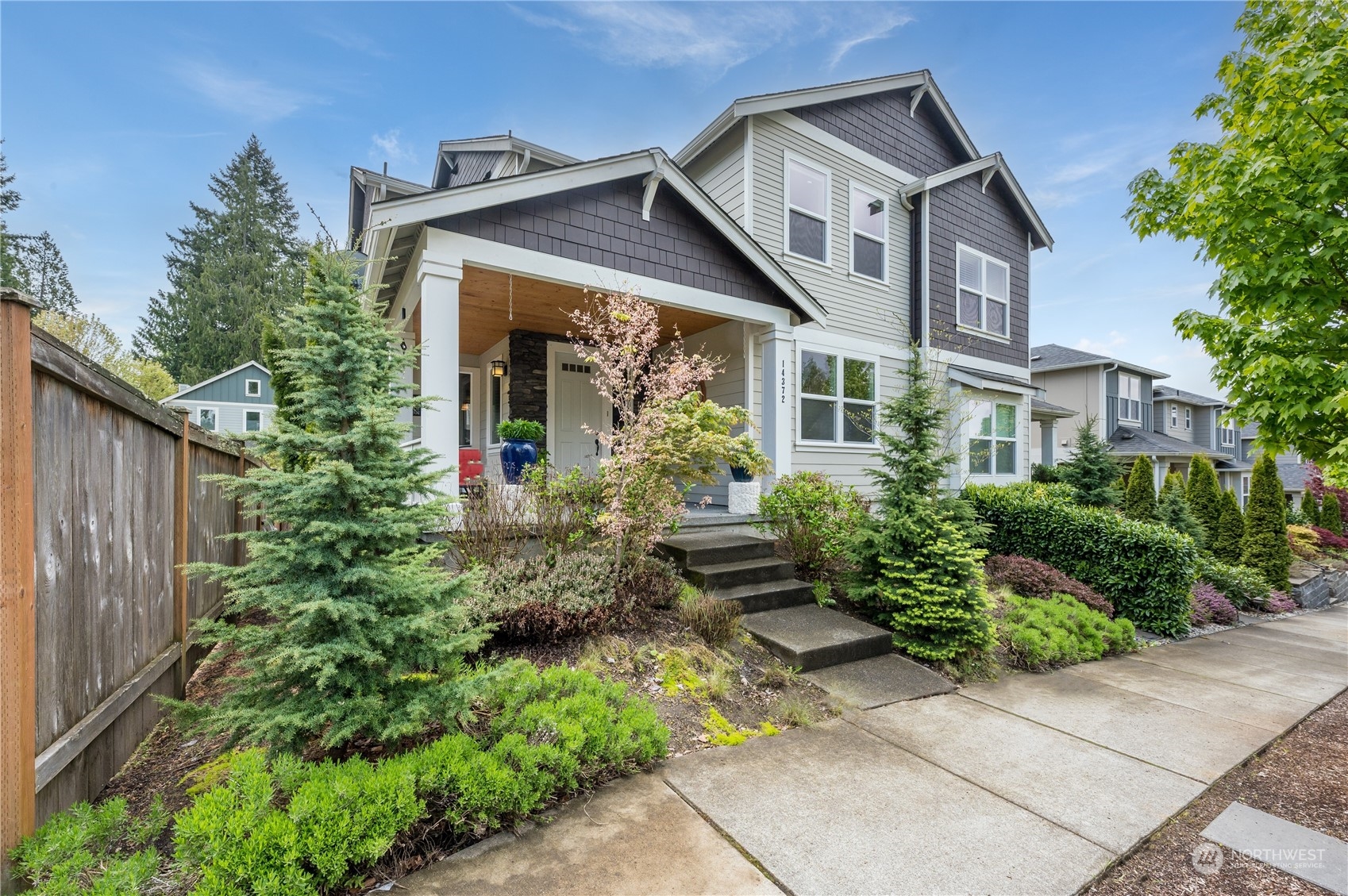 a front view of a house with garden
