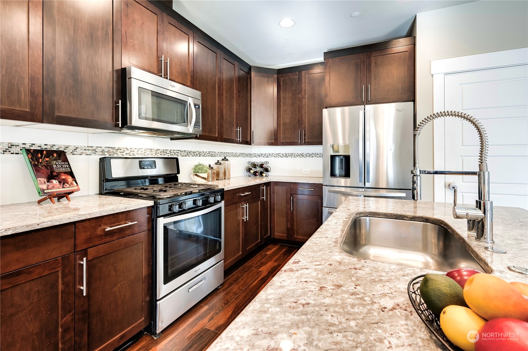14372 3rd Circle Northeast Duvall, WA 98019 - Photo 13 of 34 a kitchen with stainless steel appliances granite countertop a sink and a microwave