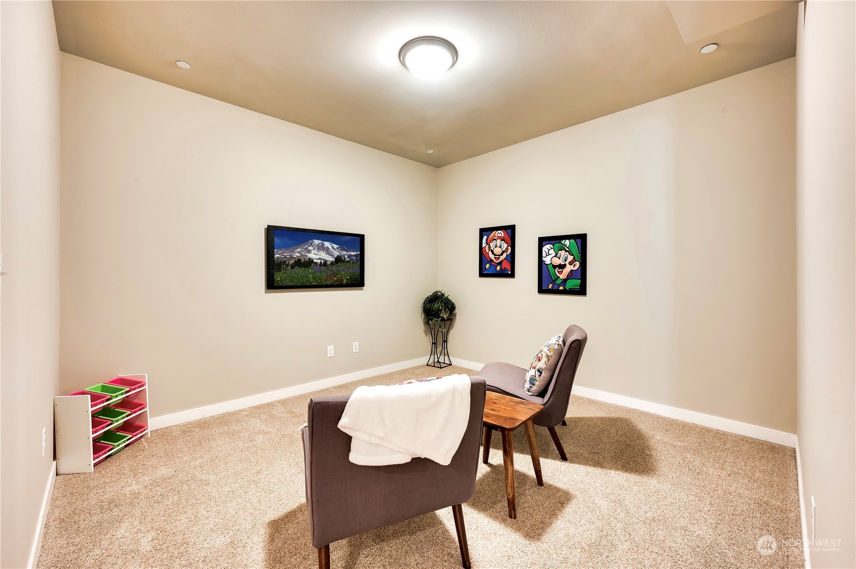 14372 3rd Circle Northeast Duvall, WA 98019 - Photo 22 of 34 a living room with furniture and a flat screen tv
