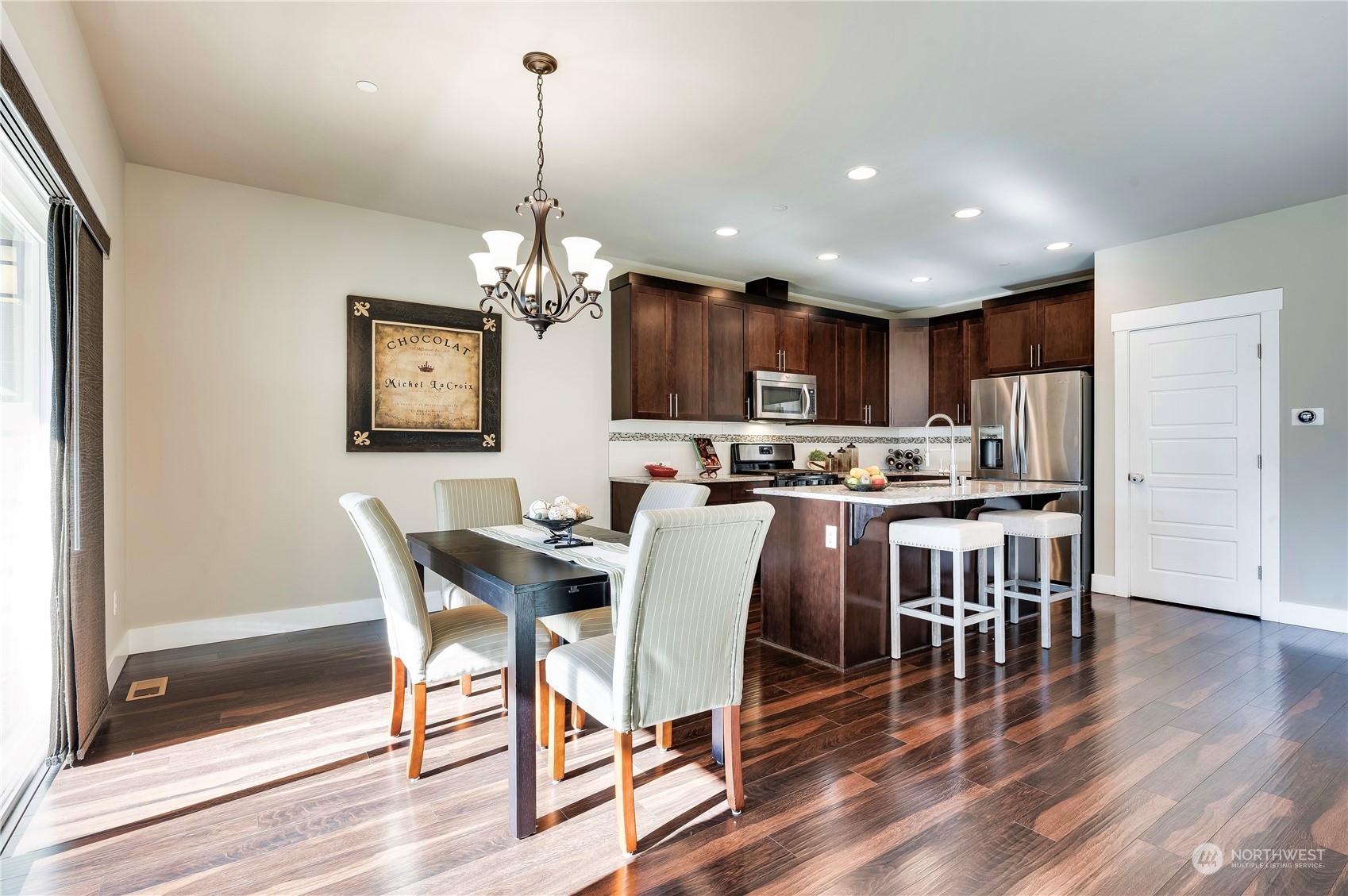 14372 3rd Circle Northeast Duvall, WA 98019 - Photo 10 of 34 a view of a dining room with furniture wooden floor and chandelier