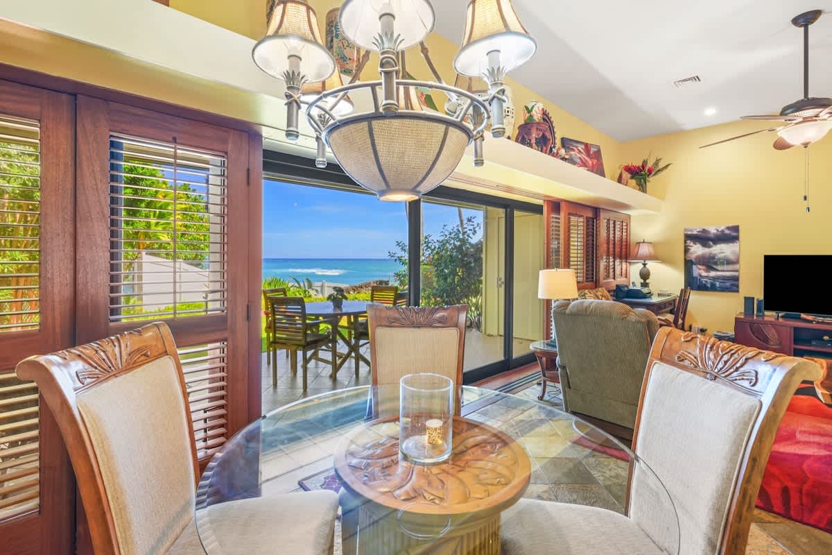 366 Papaloa Road, Unit 114 Kapaa, HI 96746 - Photo 18 of 23 a living room with furniture a window and a chandelier