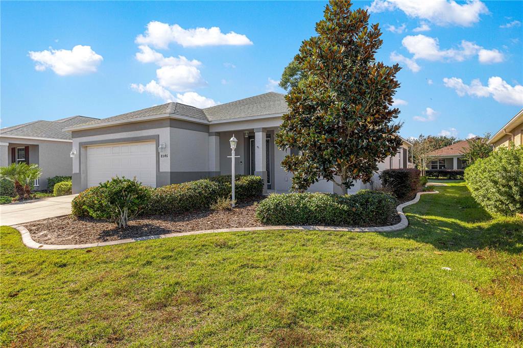 8546 Southwest 79th Avenue Ocala, FL 34476 - Photo 2 of 42 a view of a house with a yard
