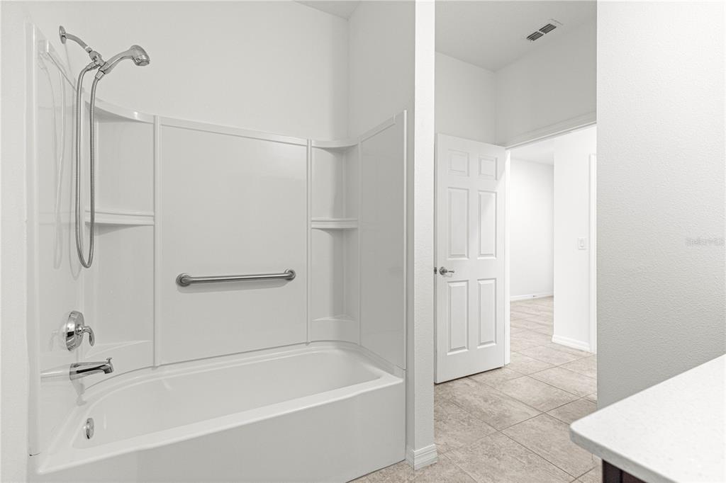 8546 Southwest 79th Avenue Ocala, FL 34476 - Photo 24 of 42 a bathroom with a bathtub and a shower