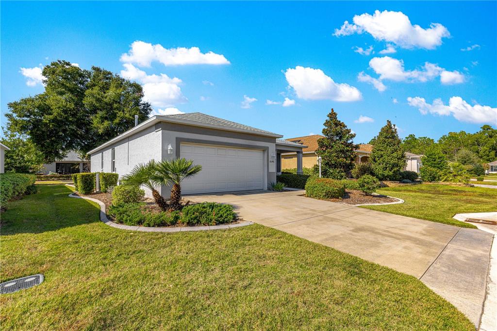 8546 Southwest 79th Avenue Ocala, FL 34476 - Photo 3 of 42 a view of a house with backyard and garden