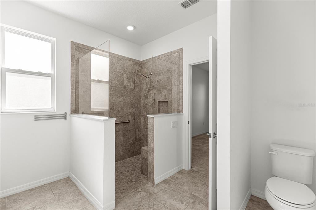 8546 Southwest 79th Avenue Ocala, FL 34476 - Photo 32 of 42 a bathroom with a shower and a toilet