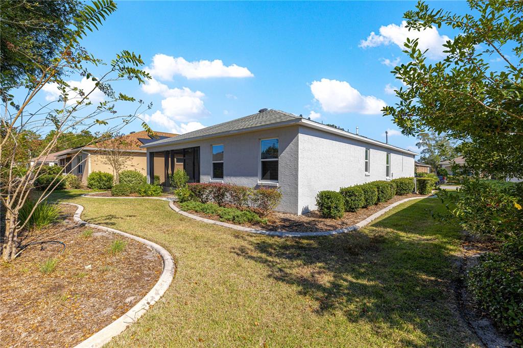 8546 Southwest 79th Avenue Ocala, FL 34476 - Photo 37 of 42 a view of a house with a yard
