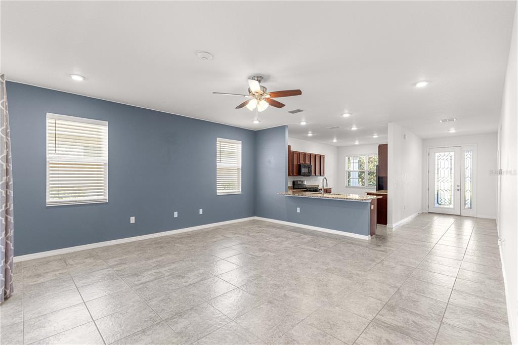 8546 Southwest 79th Avenue Ocala, FL 34476 - Photo 8 of 42 a view of a kitchen with a sink and a chandelier