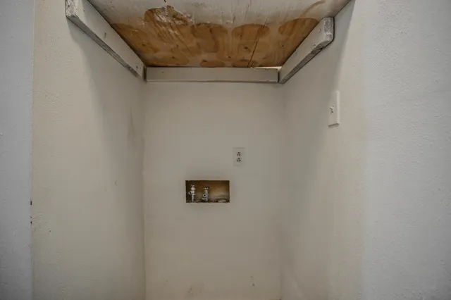 a view of a wall with an entryway