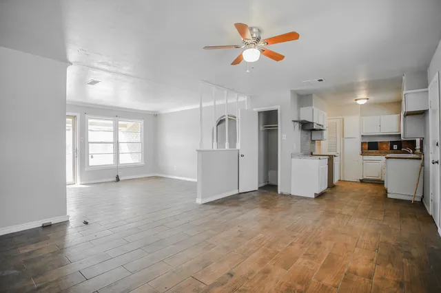a view of a kitchen with a sink dishwasher and a microwave