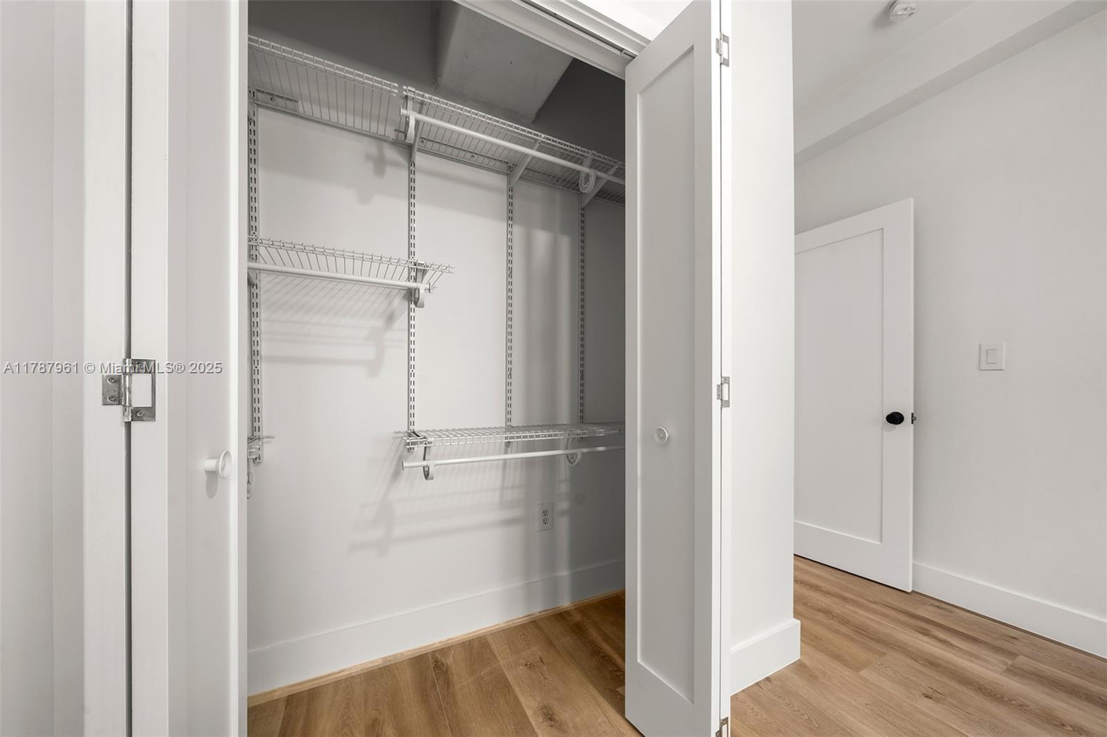 2411 Biscayne Boulevard, Unit 2 Miami, FL 33137 - Photo 18 of 25 a view of walk in closet with empty racks