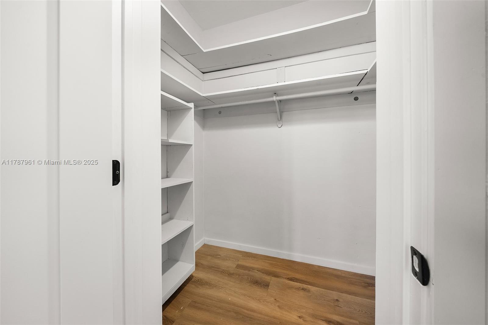 2411 Biscayne Boulevard, Unit 2 Miami, FL 33137 - Photo 19 of 25 a view of walk in closet with empty racks